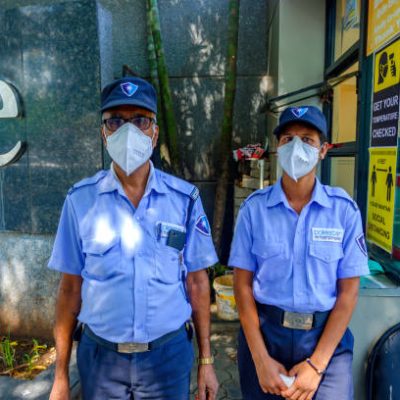 Masked security personnel at an office complex during the coronavirus pandemic at Pune India.